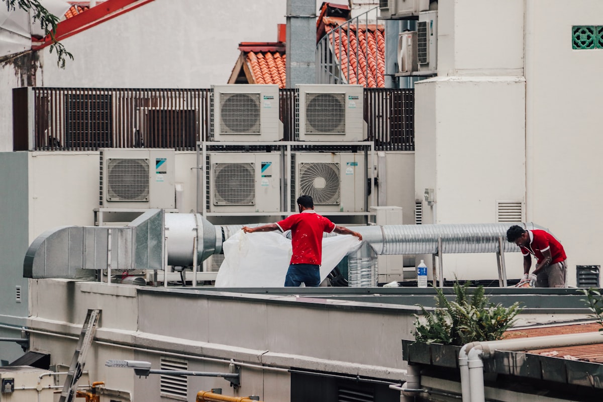 Refrigeration Technology — technicians servicing cooling units on a rooftop